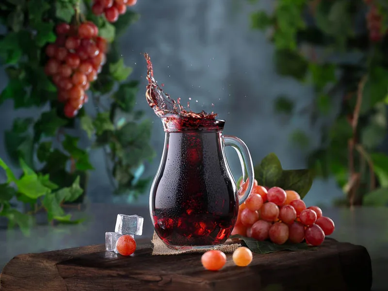 Juice splash and grapes beverage photography for a brand by Looptales